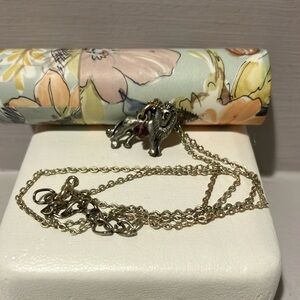 Silver Lion Pendant Necklace with purple glass gem.